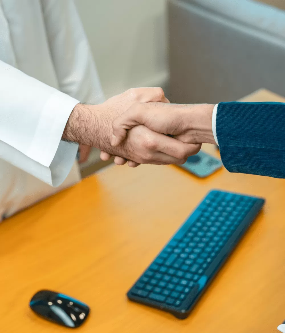 A golden hand shake at the end of the business license deal